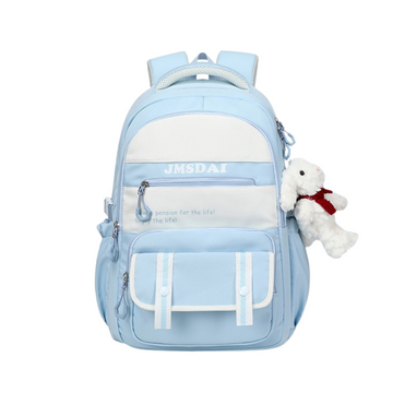 Light blue backpack with a white teddy bear attached on a white background