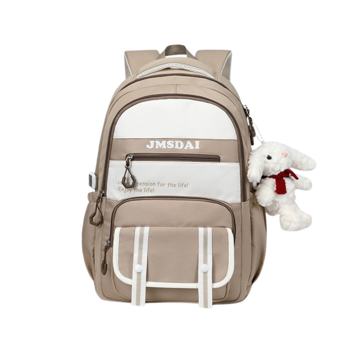 Beige backpack with white front pocket and teddy bear attached, on a white background