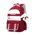 Red and white backpack with a plush toy on a white background